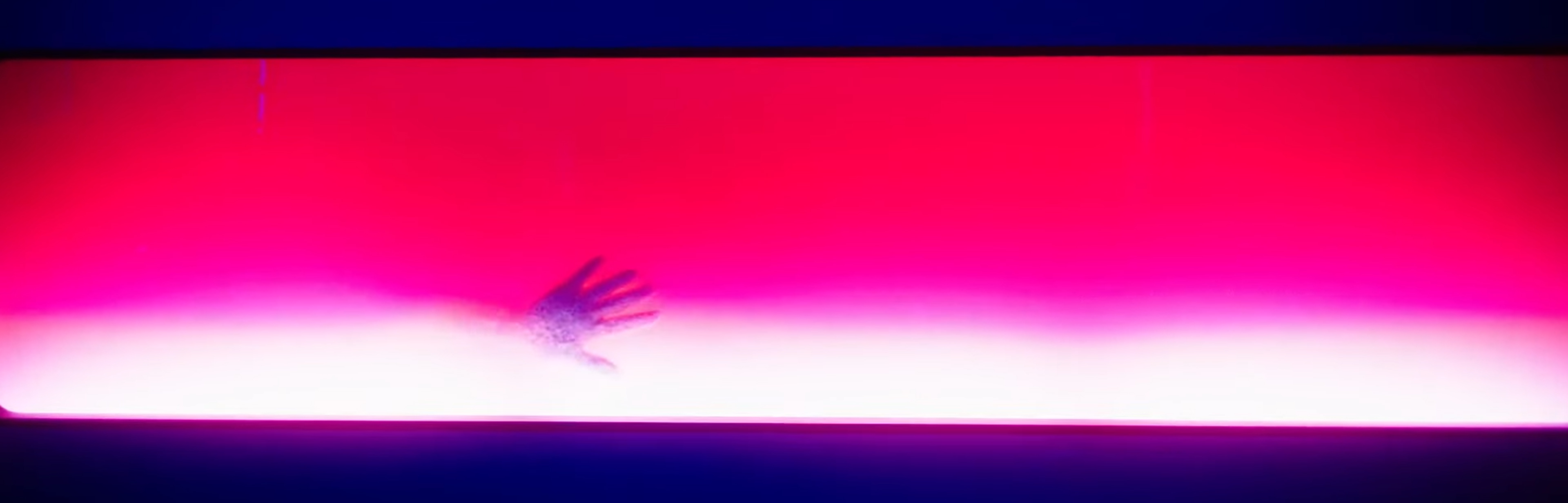 A hand appears out of red fluiid.