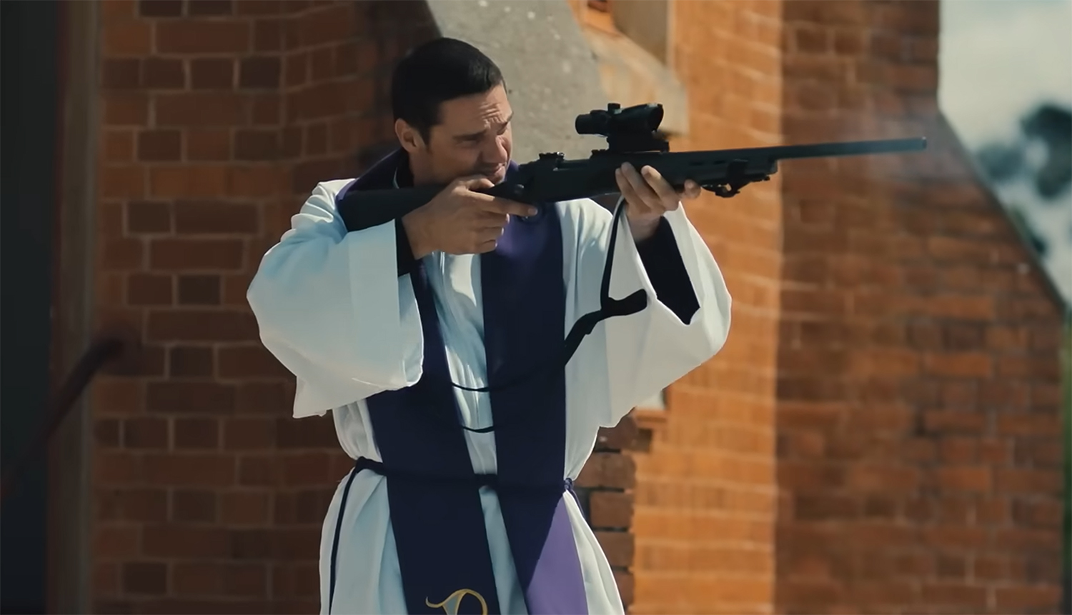 A priest firing a rifle.