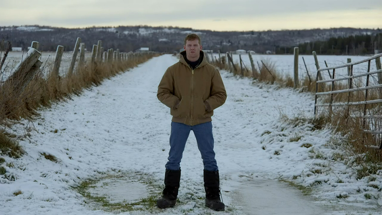 Wayne standing in snow.