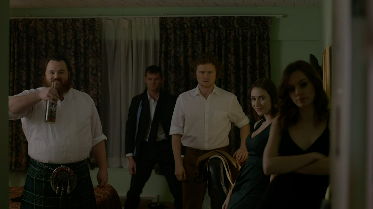 The group waiting just outside of the wedding for a fight.