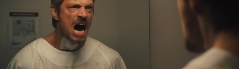 Brian screams at a mirror.