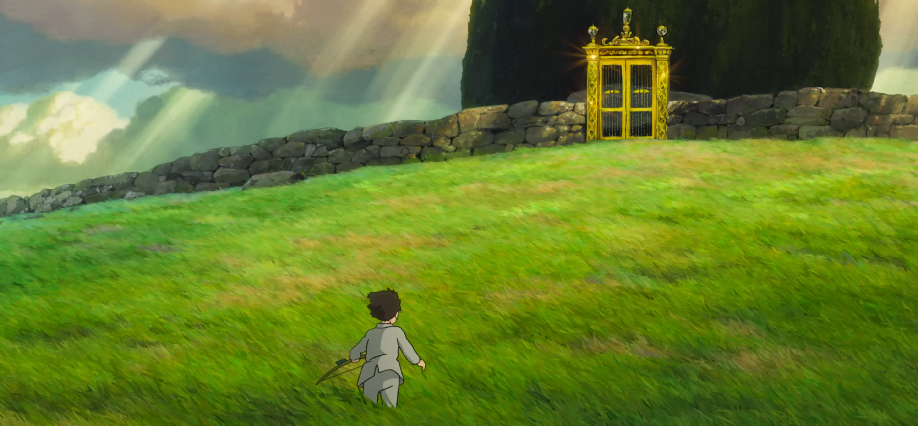 Mahito walks through grass.