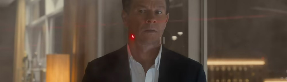 Mark Wahlberg with a laser targeting him.