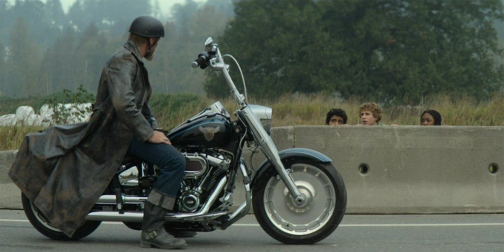 Aries on a motor cycle.