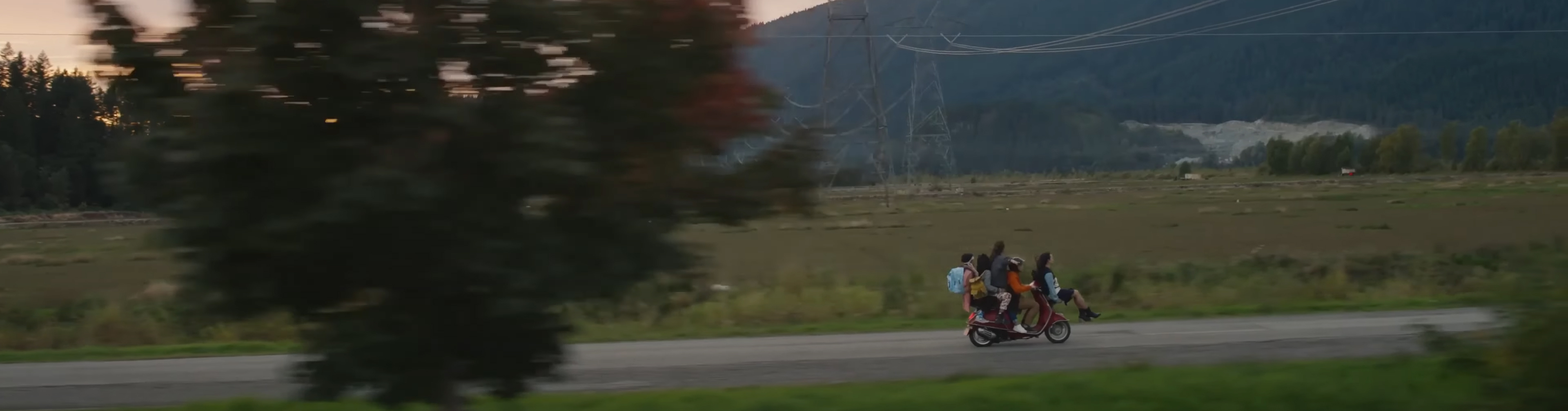 The gang on a motorbike.