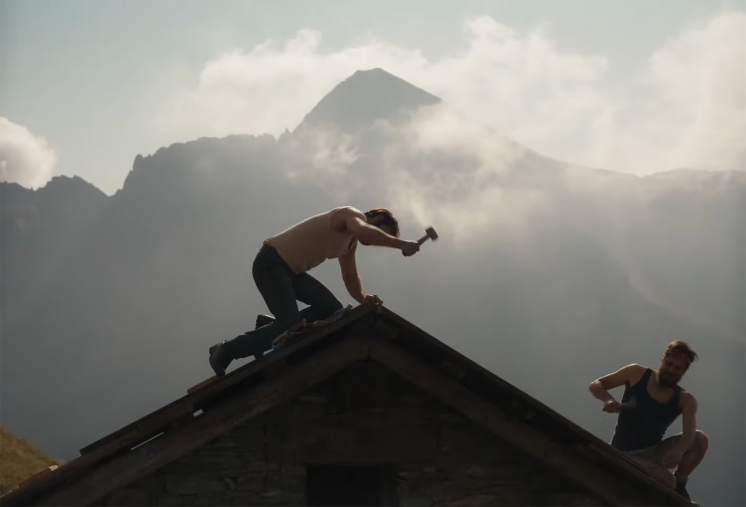 Two men Building a roof.