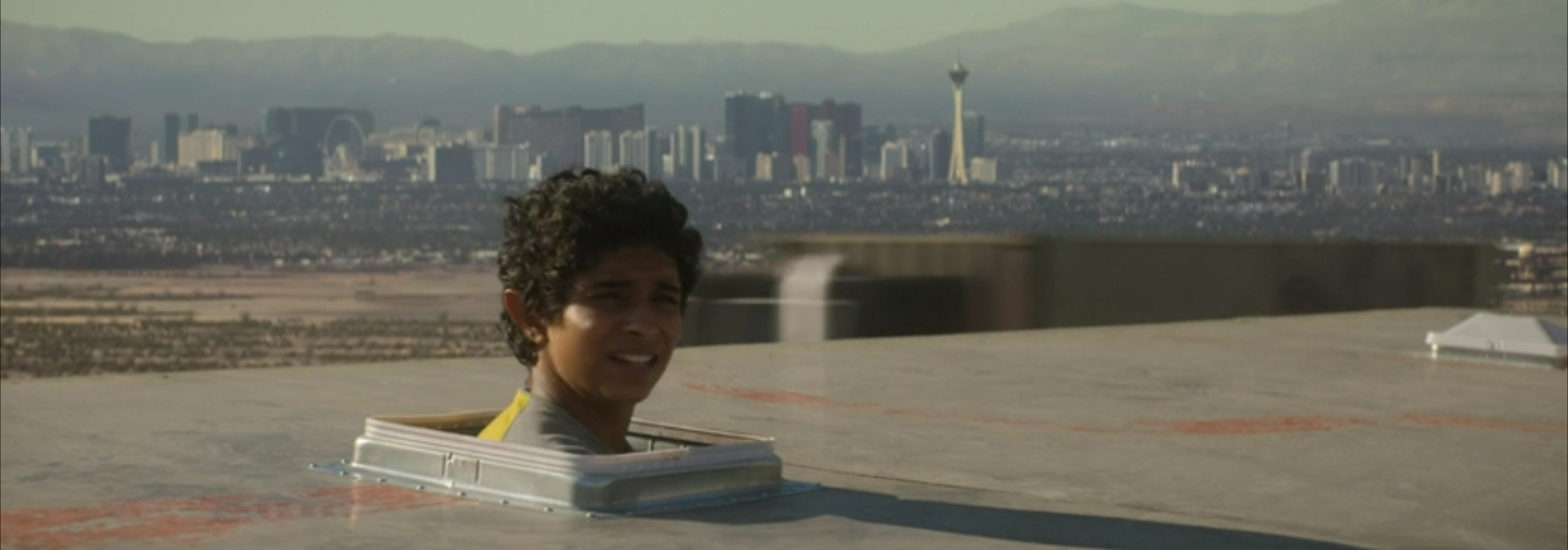 Grover pokes his head out of the top of the truck.