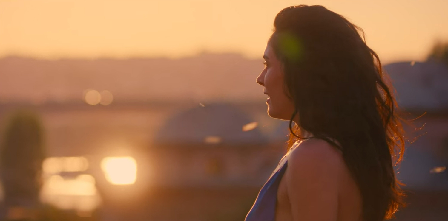 Gökçe watches the sunset.