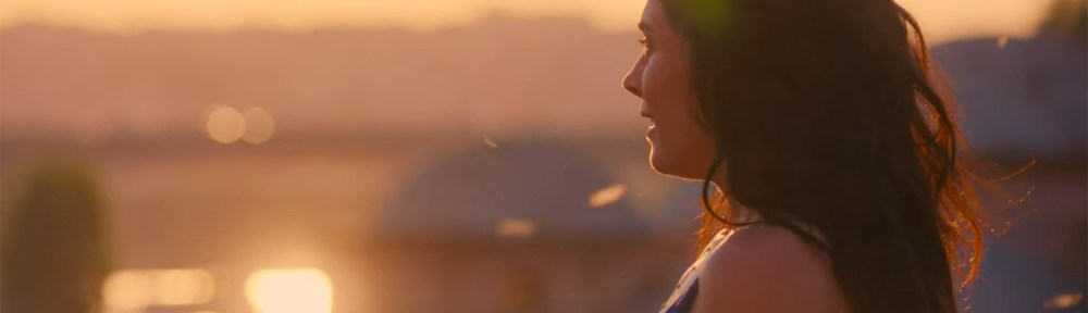 Gökçe watches the sunset.