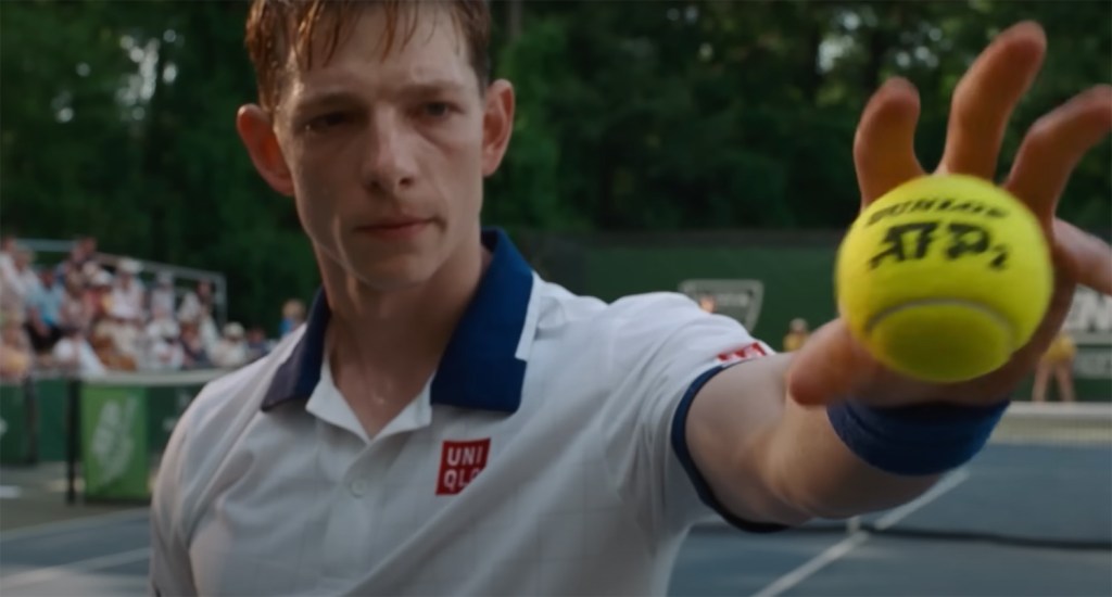 Art Donaldson (Mike Faist) catching a tennis ball.