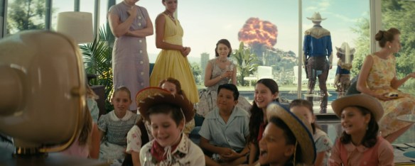 Kids play as the bombs drop behind them.