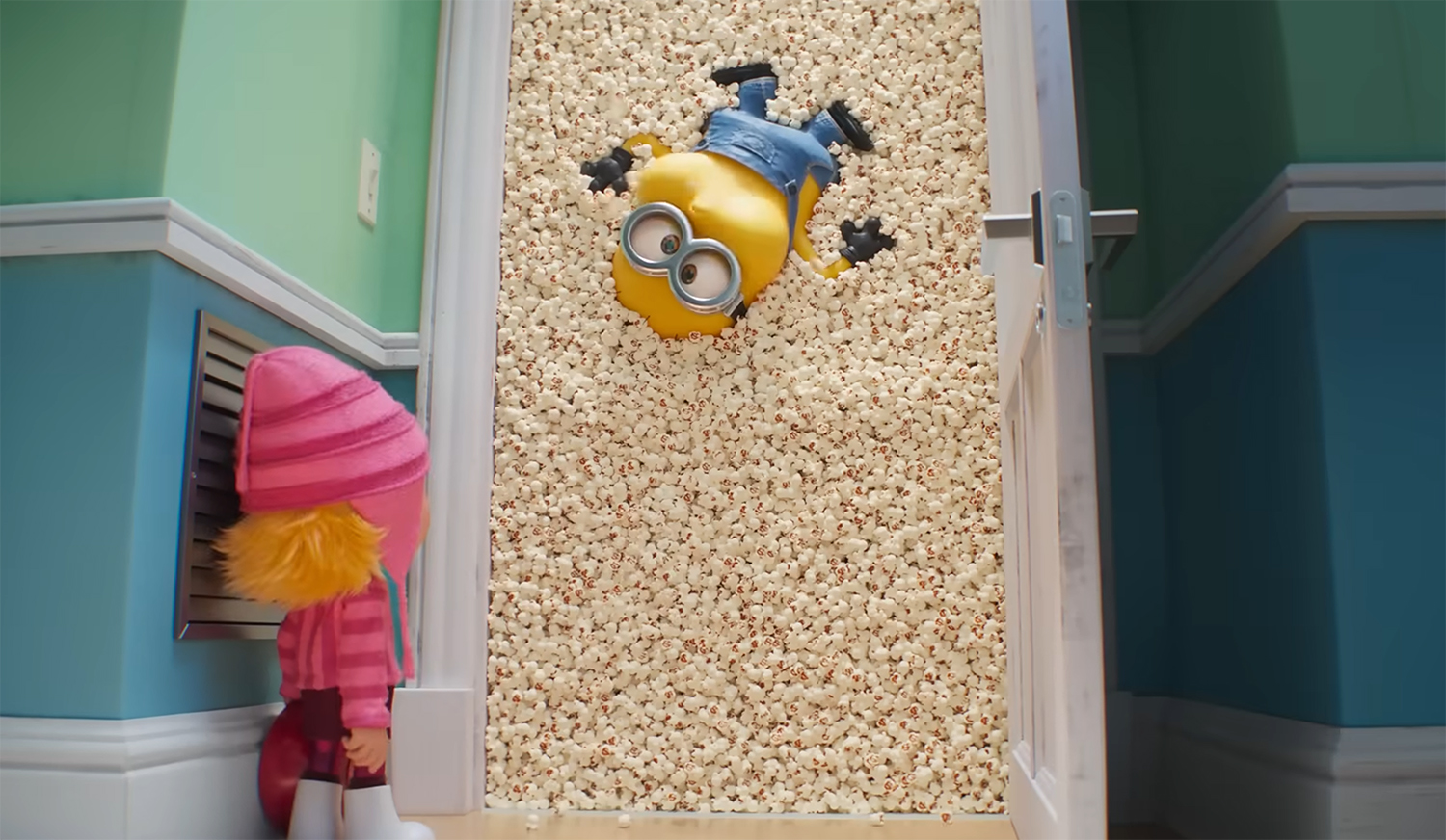 A Minions stuck in a wall of popcorn.