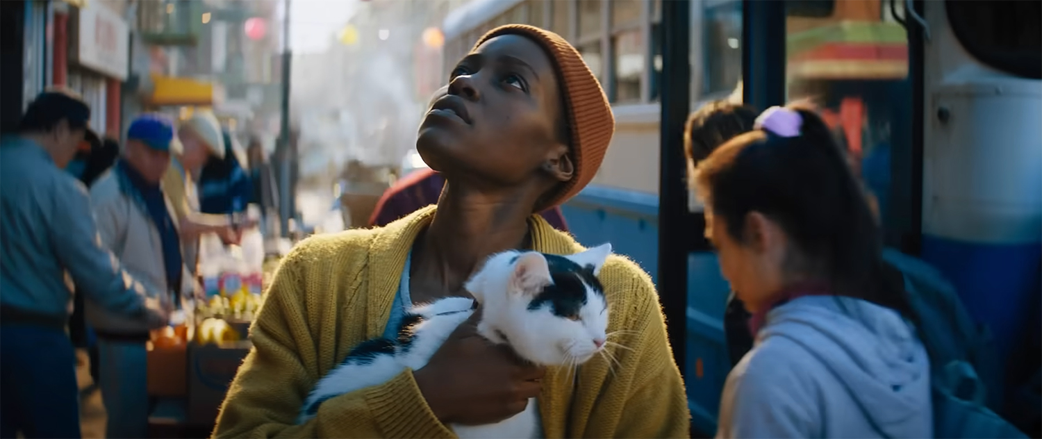 Lupita Nyong’o as Sam with her cat Frodo