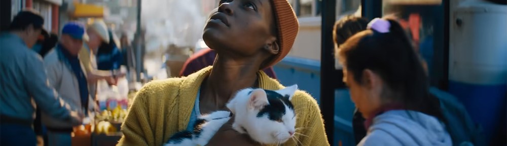 Lupita Nyong’o as Sam with her cat Frodo