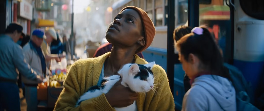 Lupita Nyong’o as Sam with her cat Frodo