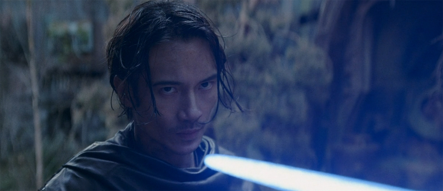 Qimir looking at the wrong end of a lightsabre.