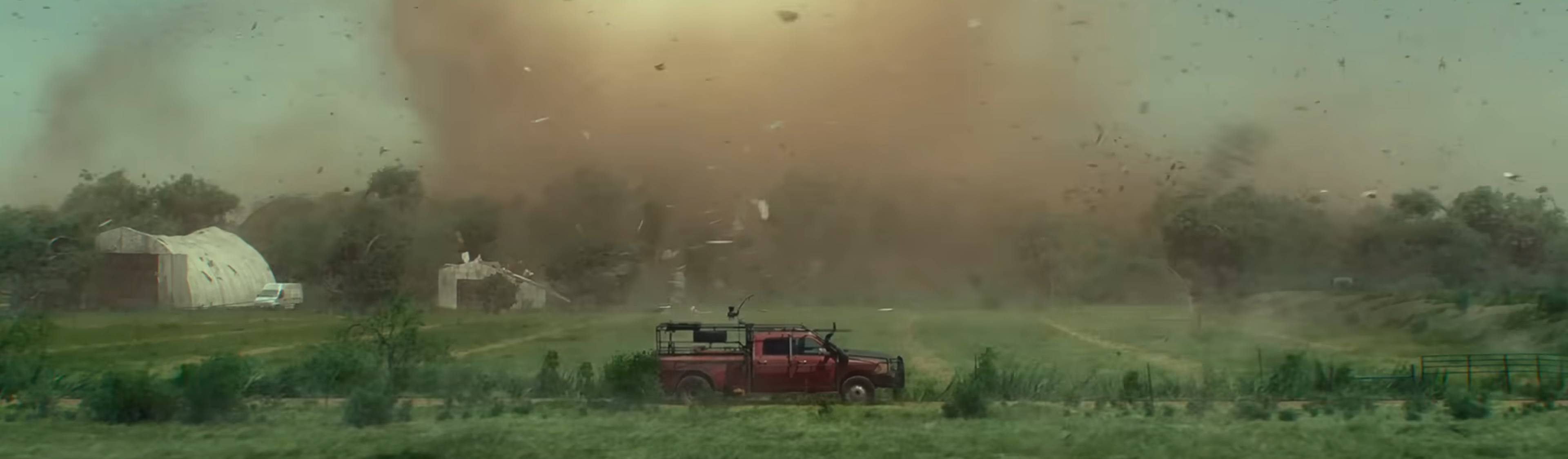 A tornado bares down on a truck.