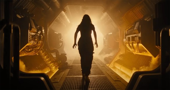 Walking into an illuminated hallway.