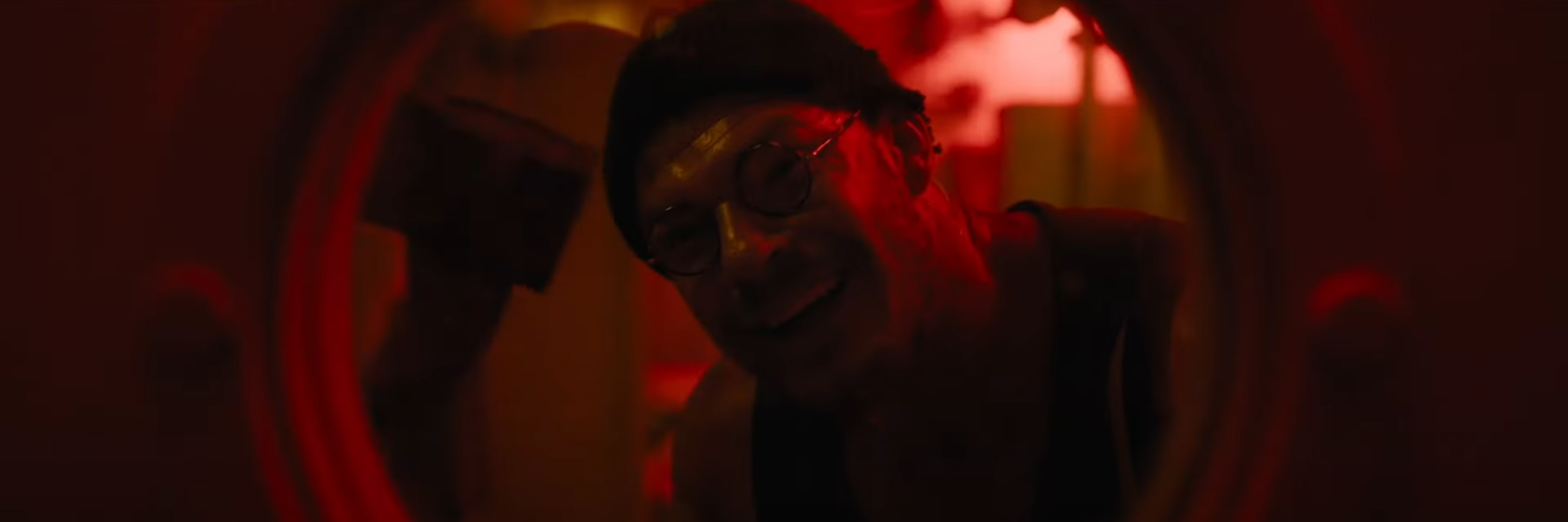 Anders Lassen looks through a porthole covered in blood.