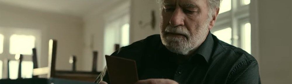 Kristófer look at a photo from his past.