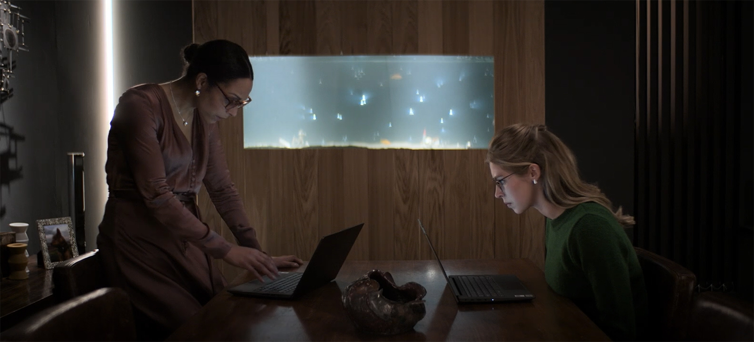 Sam and Charlie look at their laptops