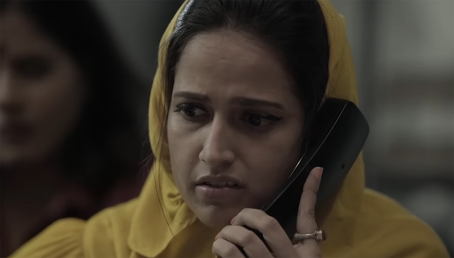 Aliah takes a phone call.