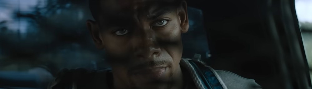 Terry is handcuffed into the back of a police cruiser.