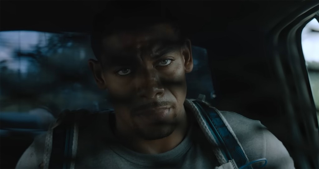 Terry is handcuffed into the back of a police cruiser.