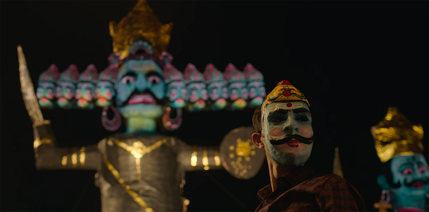 Prem hunts wearing a mask during a religious festival.