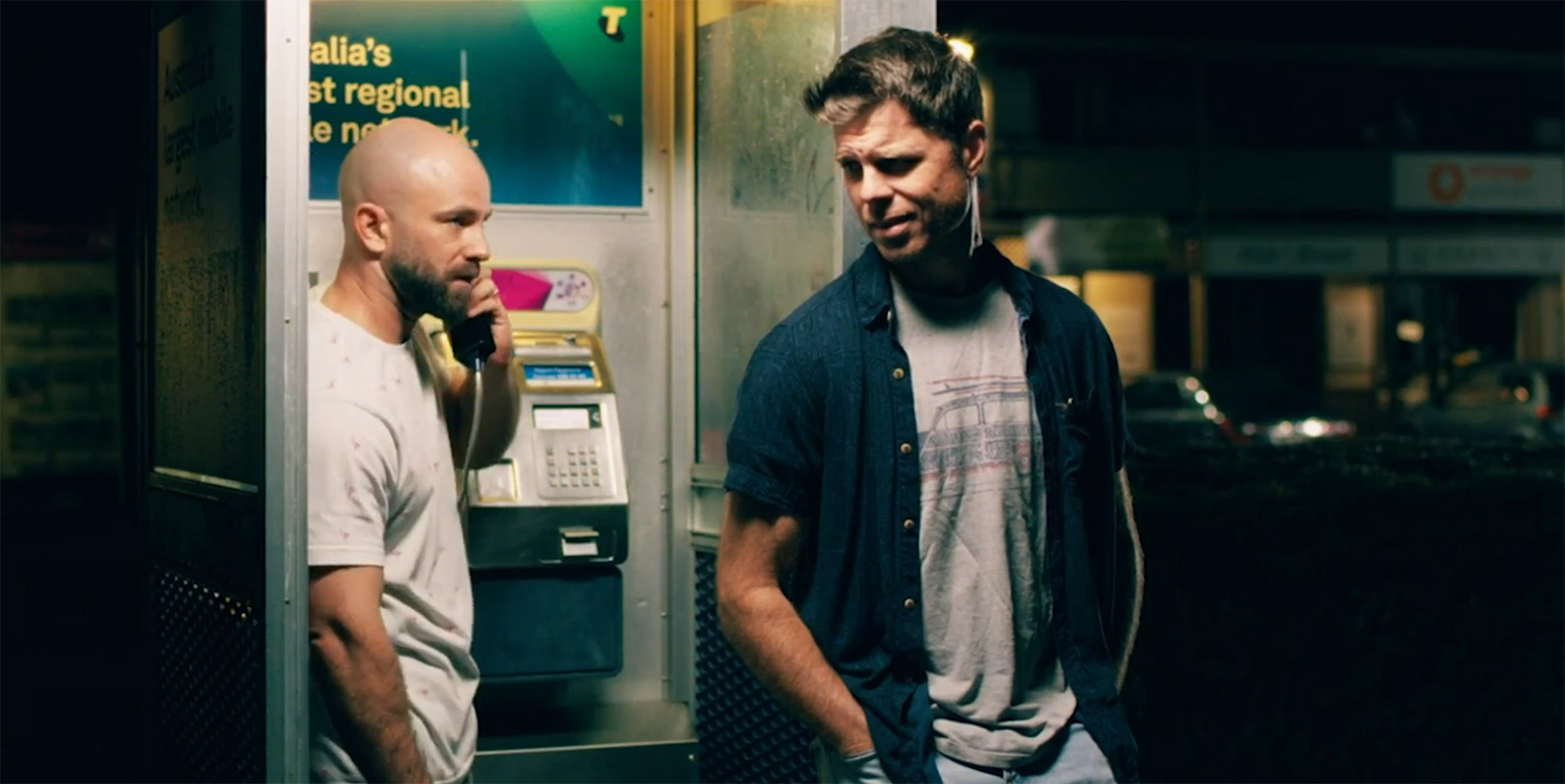 The cousins at a old pay phone.