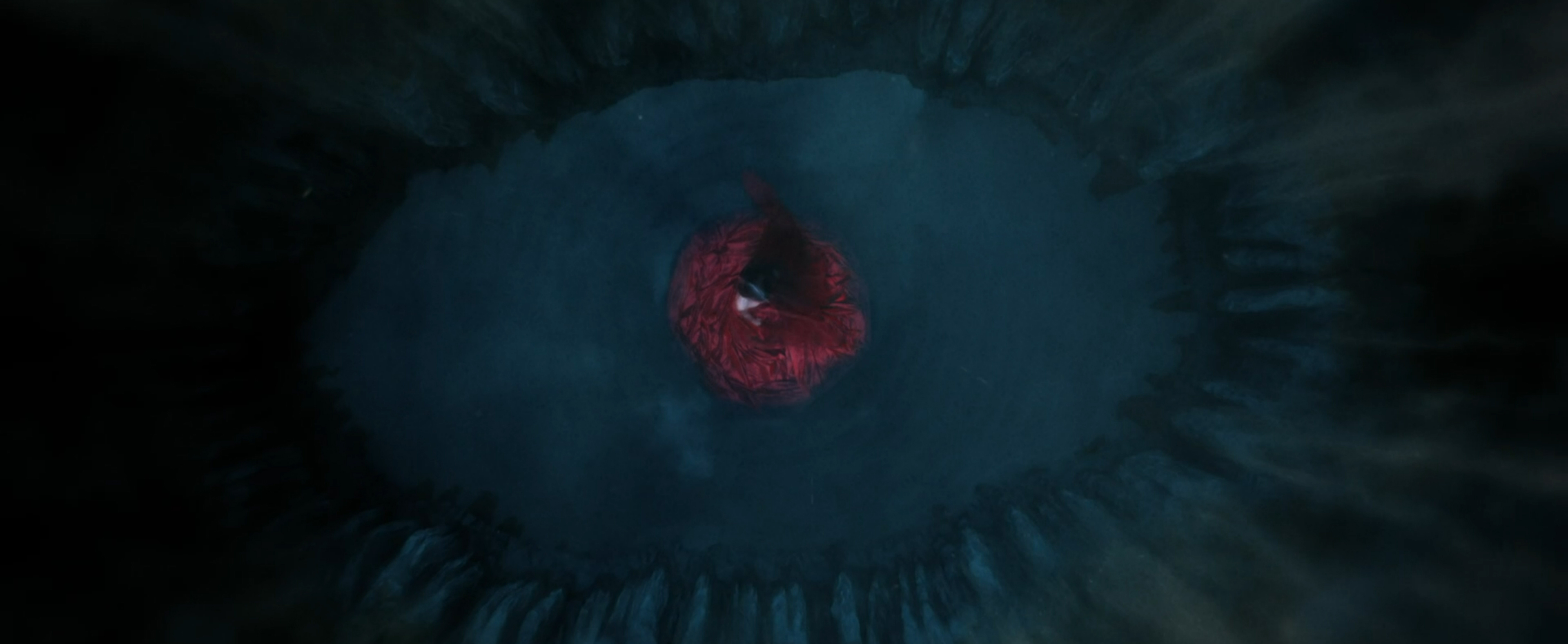 A lone figure in a red dress appears during a nightmare.