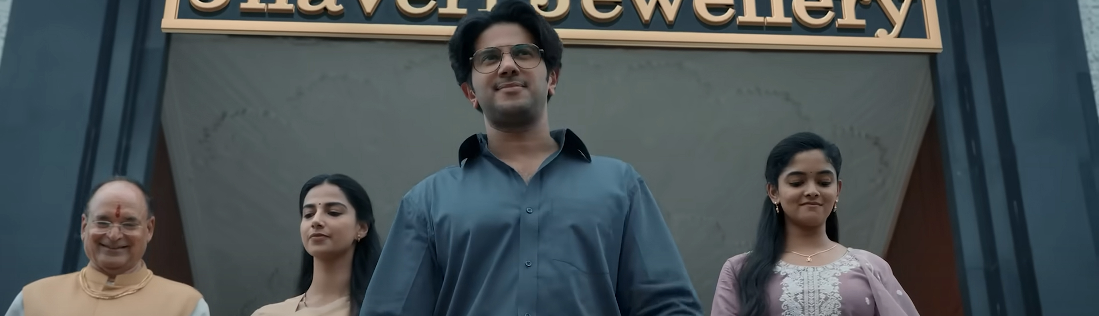 Baskhar walks out of a jewellers in triumph.