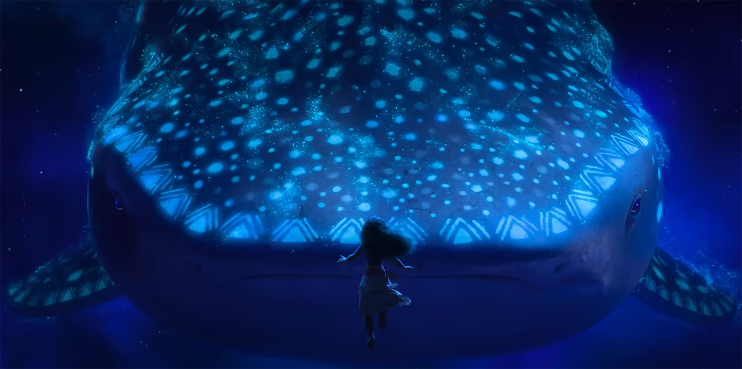 Moana swims in front of the vision of a whale shark.