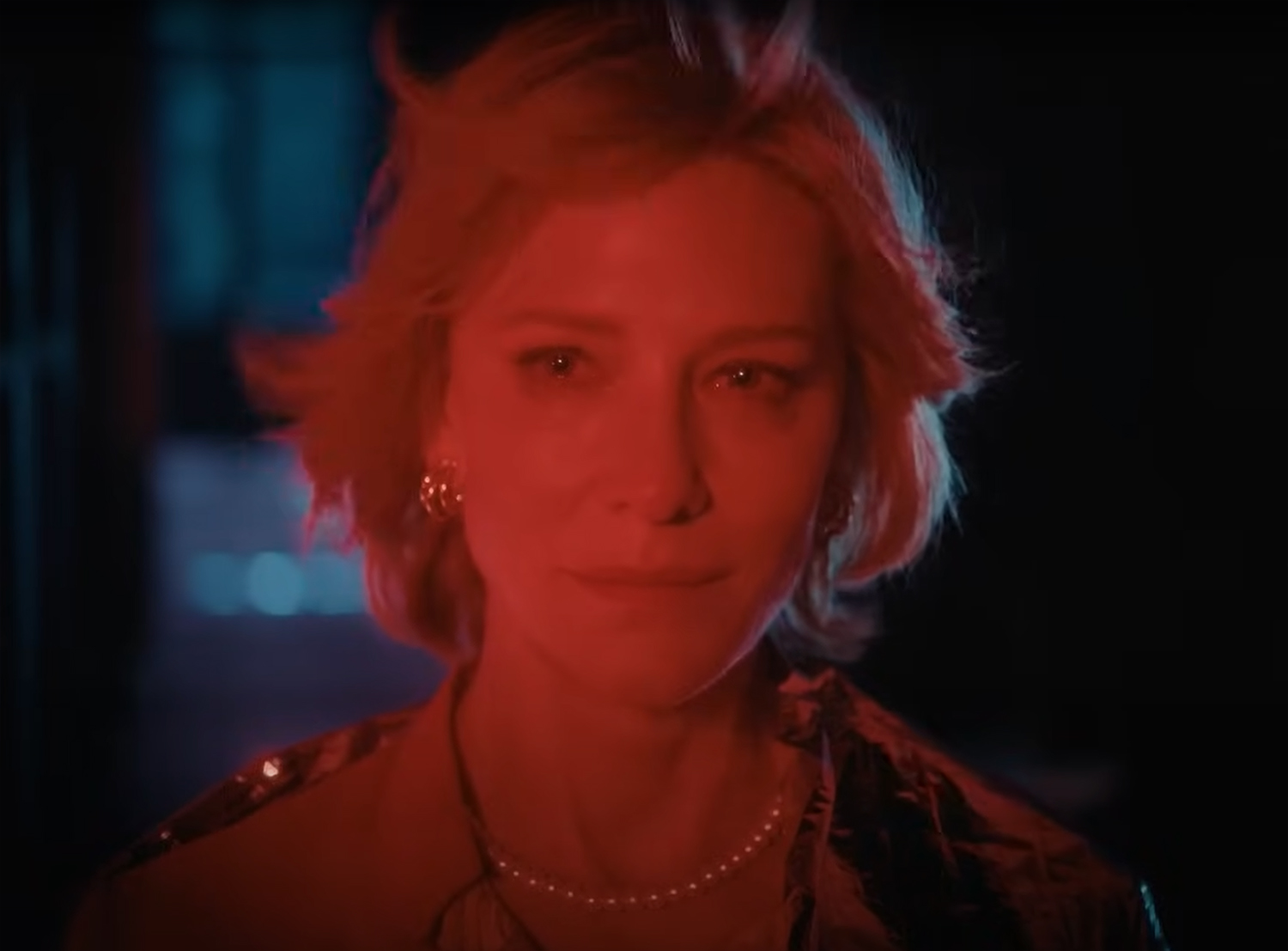 Hilda Ortmann (Cate Blanchett), the Chancellor of Germany, looks into a red light.