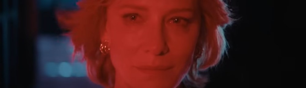Hilda Ortmann (Cate Blanchett), the Chancellor of Germany, looks into a red light.