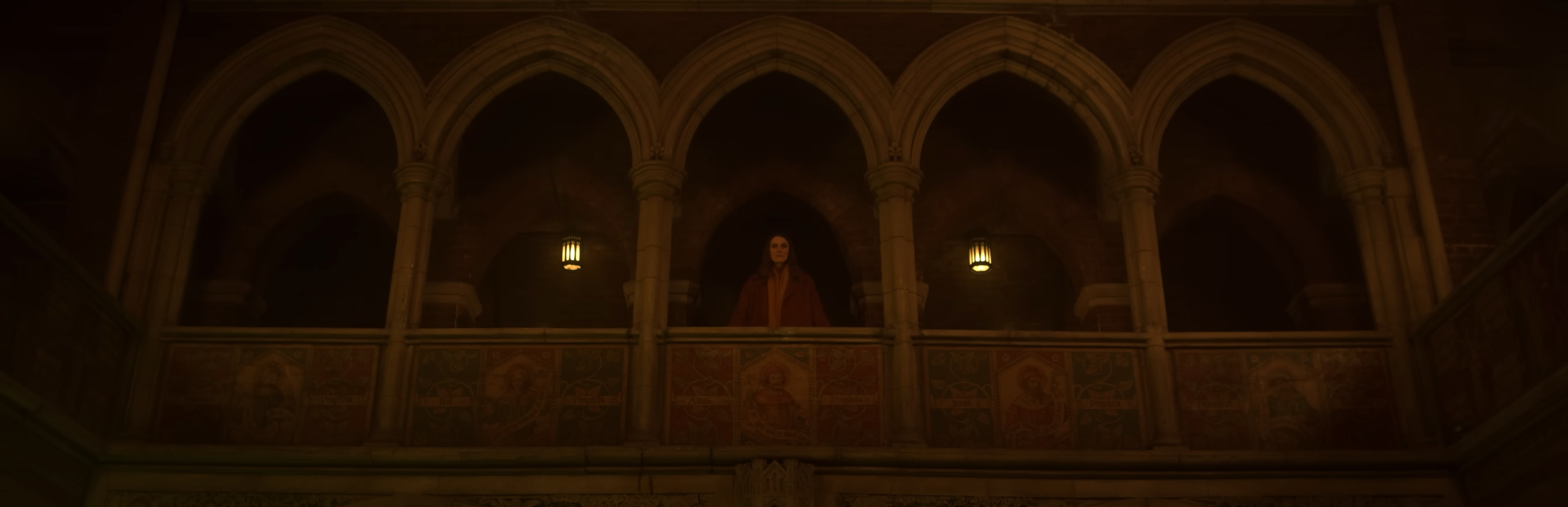 Helen looks down at a church service.