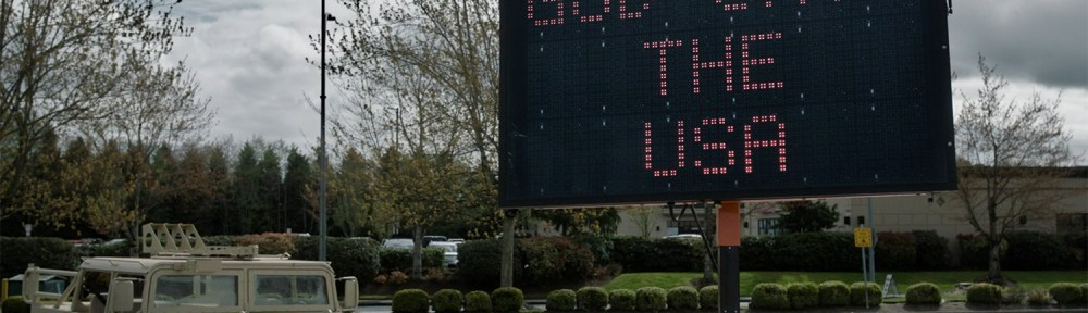 'God Save The USA' on a flashing sign.