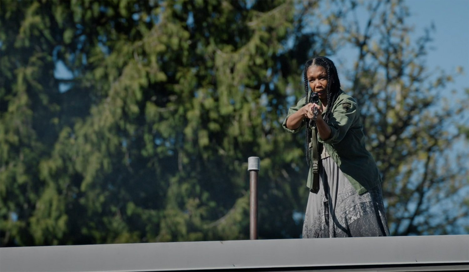 Emma says hello with a loaded gun.