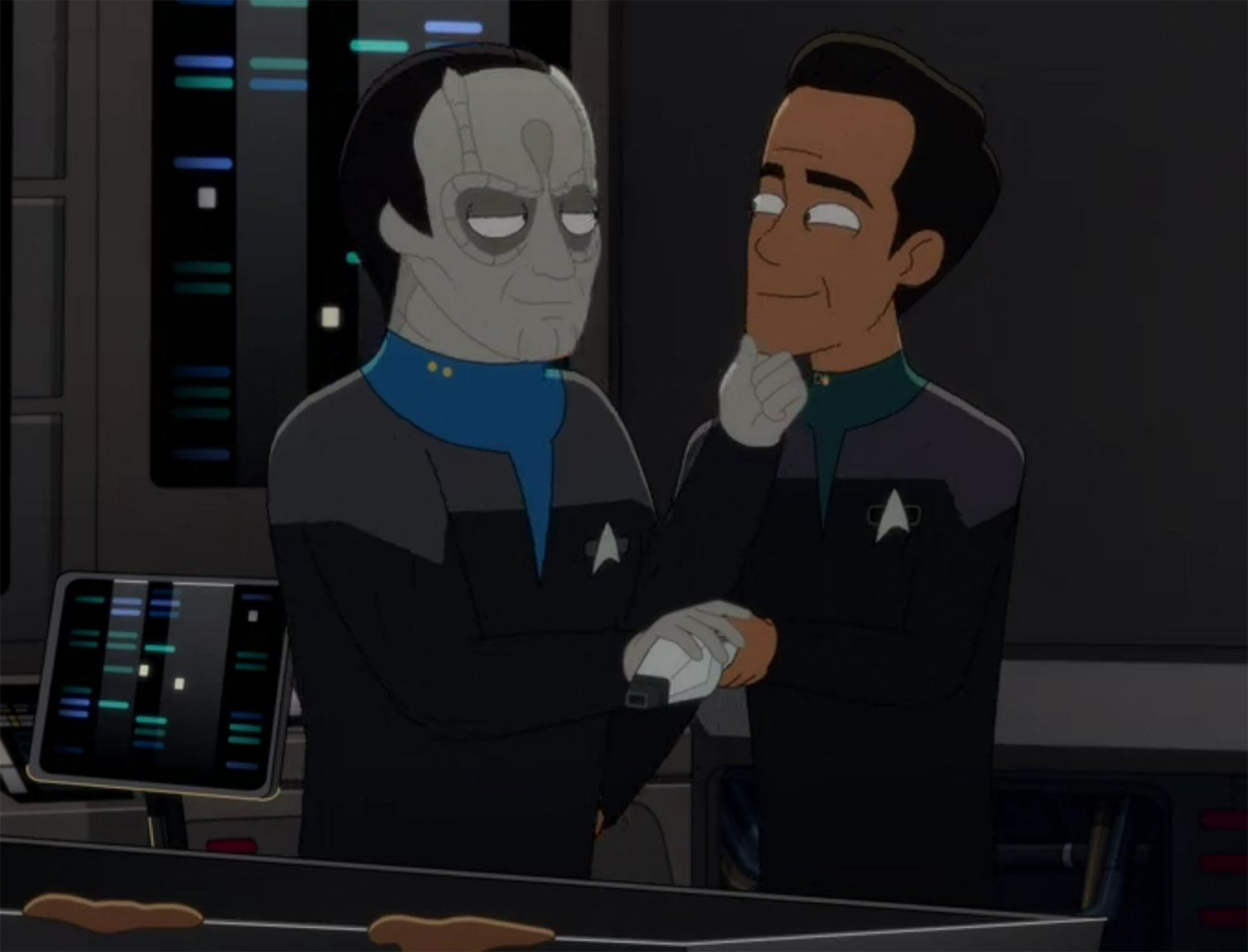 Elim Garak and Julian Bashir embrace.