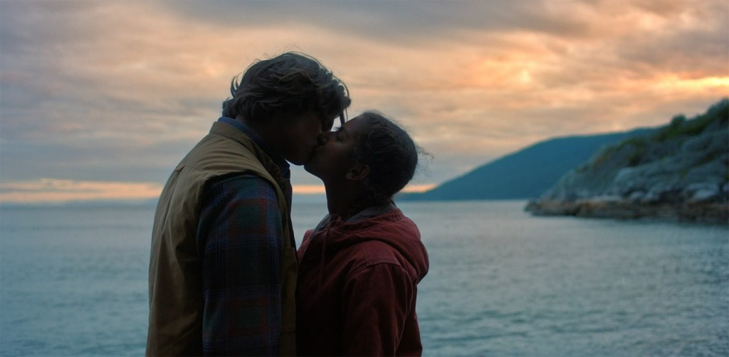 A kiss in the sunset. Image Credit: Stan.