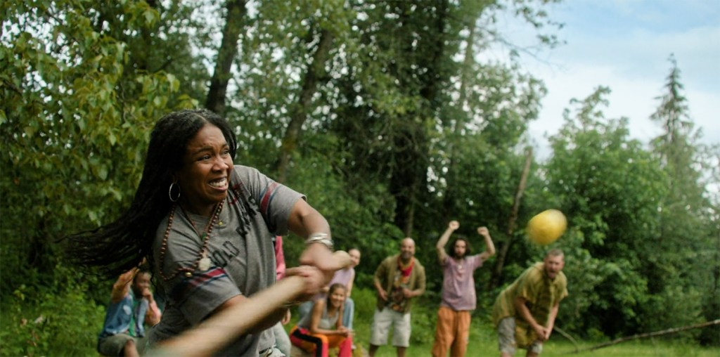 Em swings at a lemon in a game. Image Credit: Stan.