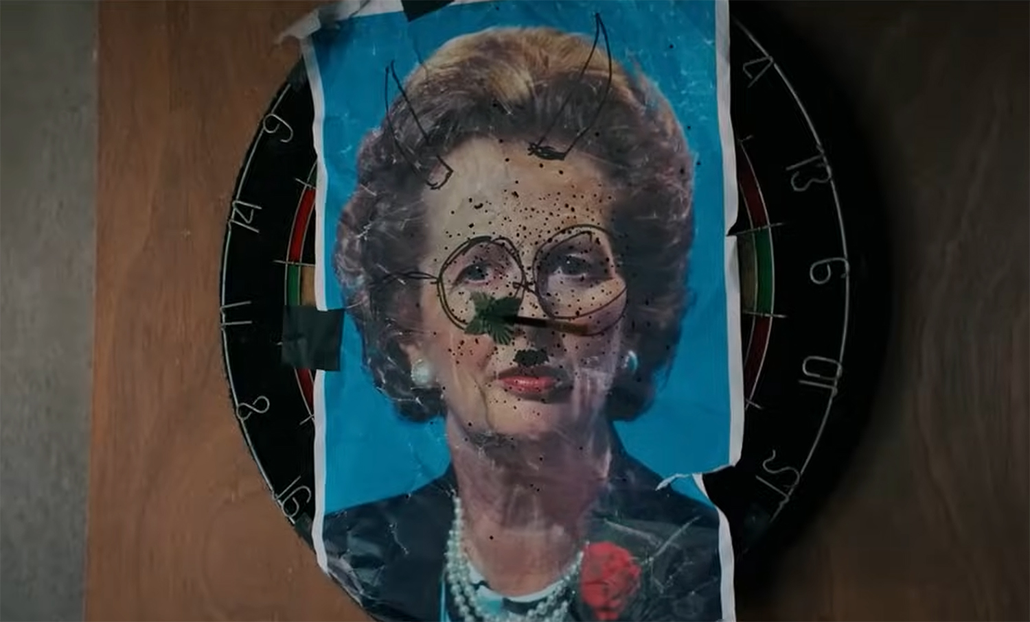 Margret Thatcher as a dart target.