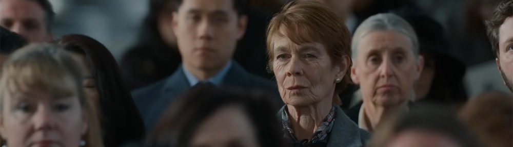 Margaret Roylin stares out from the crowd of faces.