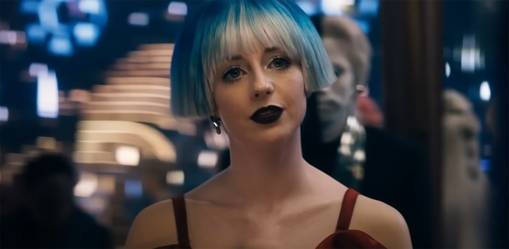Kacey Rohl as Rachel Garrett in a blue wig. 