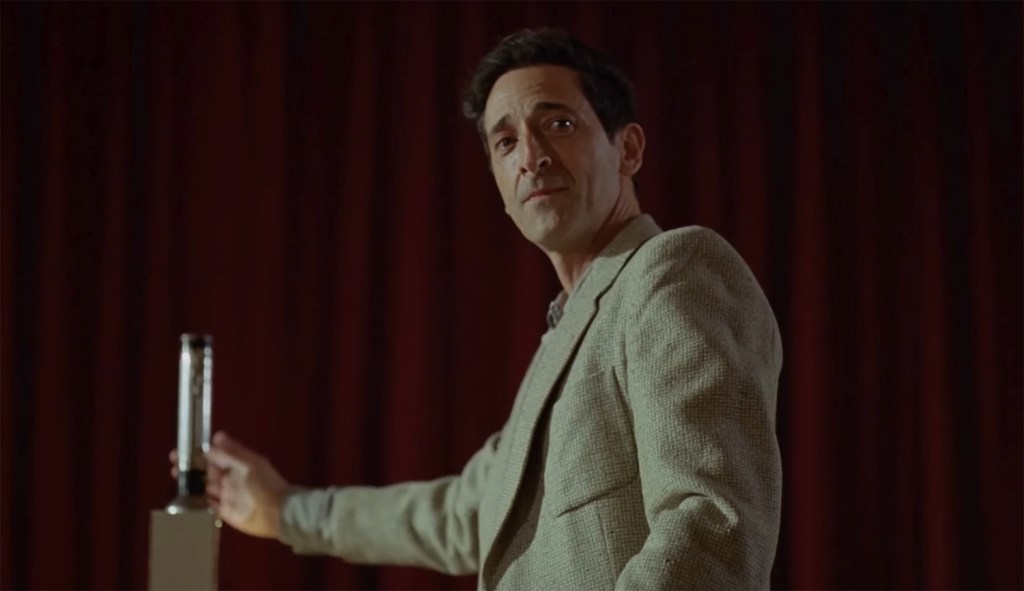 Adrien Brody near his work full of pride. 