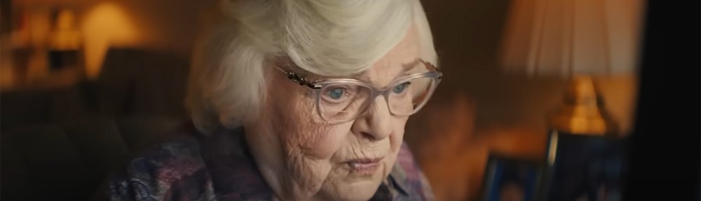 Thema looking at a computer.