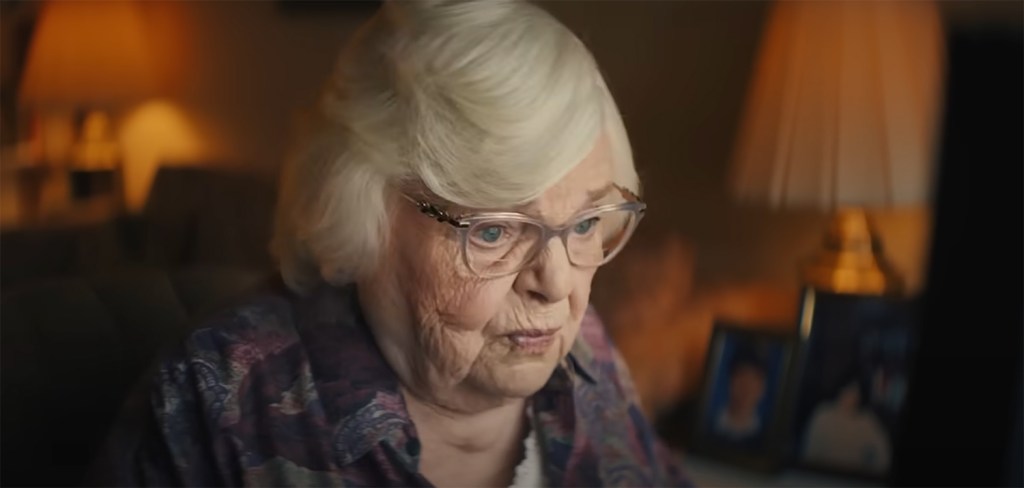 Thema looking at a computer.