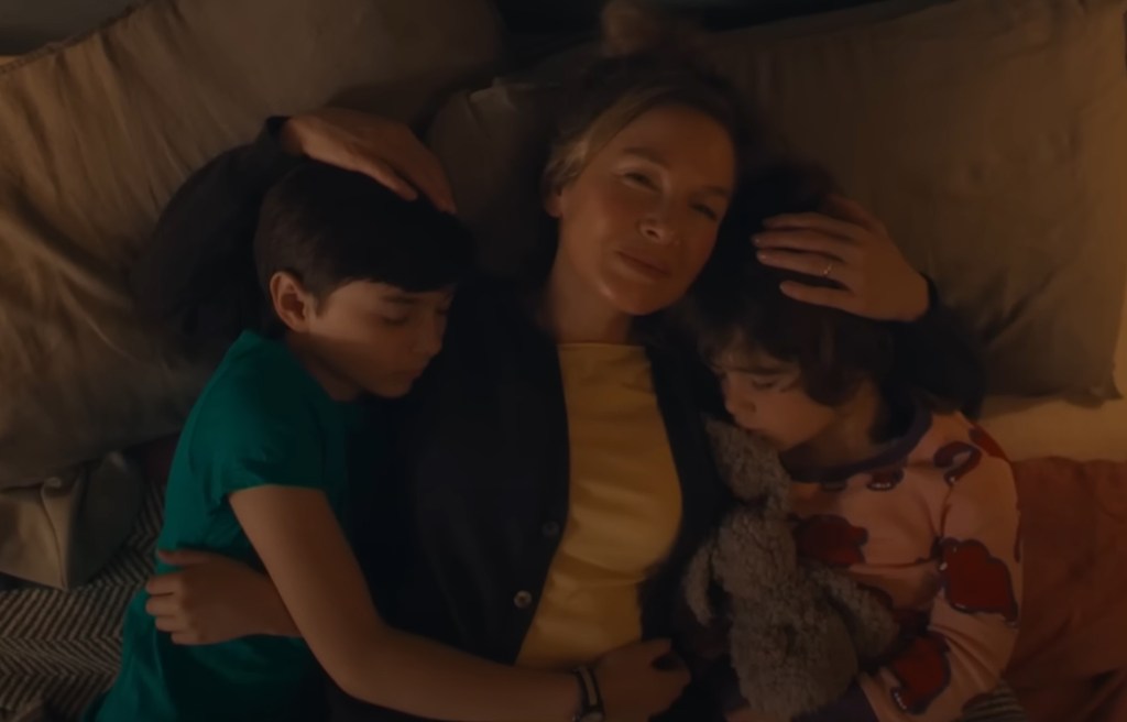 Bridget hugs her children. 