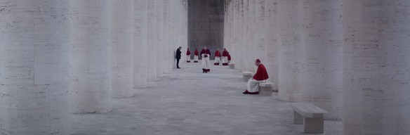 Red Cardinals against white marble columns.