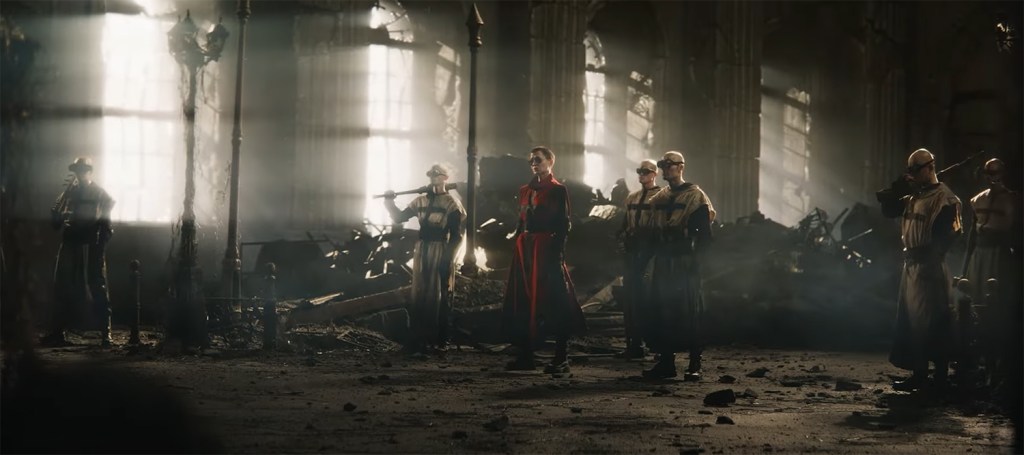 Ash stand surrounded by her henchmen. 